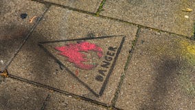 ` Danger ` sign stamped on the pavement in Ghent, Belgium royalty free stock images ` Danger ` sign stamped on the pavement in Ghent, Belgium royalty free stock images