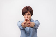 Dangerous european mature woman ready to shoot you down Stock Photos Dangerous european mature woman ready to shoot you down Stock Photos