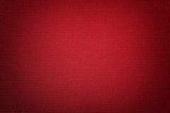 Dark red background from a textile material with wicker pattern, closeup royalty free stock photos Dark red background from a textile material with wicker pattern, closeup royalty free stock photos
