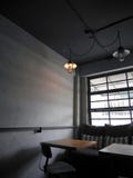 Dark room with orange light and backlited window stock photo Dark room with orange light and backlited window stock photo