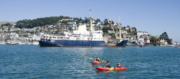 Kayaks on the Dart River, at Dartmouth in Devon, England royalty free stock images Kayaks on the Dart River, at Dartmouth in Devon, England royalty free stock images