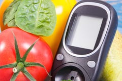 Date of 14 November, glucometer and fresh vegetables, world diabetes day concept royalty free stock photo Date of 14 November, glucometer and fresh vegetables, world diabetes day concept royalty free stock photo