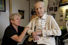 Daughter visiting Dad at Long Term Care Facility stock image Daughter visiting Dad at Long Term Care Facility stock image