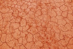 De gebarsten, droge aarde is rood Een woestijn zonder water Dorre grond Dorst voor vochtigheid op een futloze ruimte Ecologische stock foto's De gebarsten, droge aarde is rood Een woestijn zonder water Dorre grond Dorst voor vochtigheid op een futloze ruimte Ecologische stock foto's