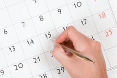 De hand schrijft in kalender royalty-vrije stock afbeelding De hand schrijft in kalender royalty-vrije stock afbeelding