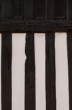 De muurclose-up van het houtplattelandshuisje stock afbeelding De muurclose-up van het houtplattelandshuisje stock afbeelding