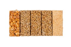 De staven van de honing. pinda's, sesam en zonnebloemzaden royalty-vrije stock foto De staven van de honing. pinda's, sesam en zonnebloemzaden royalty-vrije stock foto