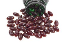 De supplementen van de Amerikaanse veenbes het morsen Stock Foto De supplementen van de Amerikaanse veenbes het morsen Stock Foto