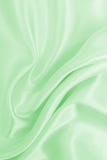 De vlotte elegante groene zijde of satijntextuur van de luxedoek als samenvatting royalty-vrije stock fotografie De vlotte elegante groene zijde of satijntextuur van de luxedoek als samenvatting royalty-vrije stock fotografie