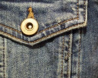 De zak van het denimflard met knoop dichte omhooggaand stock foto De zak van het denimflard met knoop dichte omhooggaand stock foto