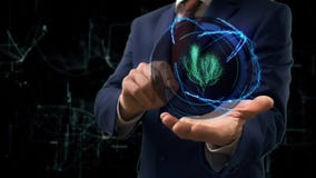 De zakenman toont conceptenhologram 3d boom op zijn hand De zakenman toont conceptenhologram 3d boom op zijn hand