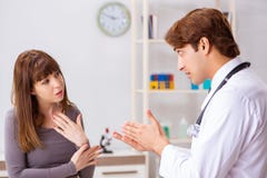 The deaf-mute female patient visiting young male doctor stock photography The deaf-mute female patient visiting young male doctor stock photography