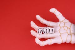 Skeleton hand with dice stock image. Image of gamble 