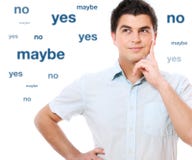 Decision maker. A portrait of a young handsome man trying to make decision over white background Decision maker. A portrait of a young handsome man trying to make decision over white background