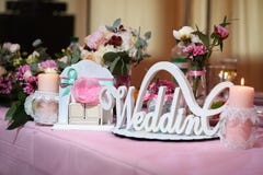 Decor wedding word Wedding on the background of flowers, candle