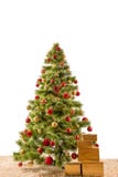 Decorated Christmas Tree On A Carpet With Gifts Royalty Free Stock Image