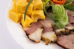 Decoration of meat cuts from sausage, bacon with hard cheese stock images Decoration of meat cuts from sausage, bacon with hard cheese stock images