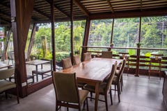 The wood table in the glass house ,decoration of room with wood stock photo The wood table in the glass house ,decoration of room with wood stock photo