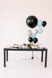 Decorations for holiday party. A lot of balloons blue, black and white colors. Black And White Birthday party decoration