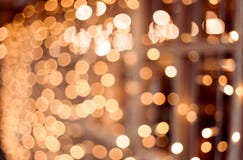 Decorative outdoor string lights at night time, Defocused Background, night city life backdrop, party time with Yellow bokeh balls