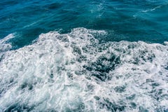 Deep blue stormy sea water surface with white foam and waves pattern. Background photo texture Stock Image Deep blue stormy sea water surface with white foam and waves pattern. Background photo texture Stock Image