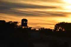 Deer Stand at Sunset stock photo Deer Stand at Sunset stock photo