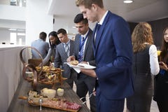 Delegates At Lunch Buffet During Conference Break royalty free stock images Delegates At Lunch Buffet During Conference Break royalty free stock images