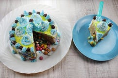 Delicious cake slice on a blue and white plate with chocolate candies royalty free stock images Delicious cake slice on a blue and white plate with chocolate candies royalty free stock images