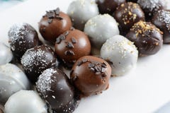 Delicious Chocolate Balls - Various Types Served On White Background With Coffee Stock Photography