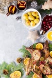 Christmas dinner with roasted meat steak, Christmas Wreath salad, baked potato, grilled vegetables, cranberry sauce royalty free stock photo Christmas dinner with roasted meat steak, Christmas Wreath salad, baked potato, grilled vegetables, cranberry sauce royalty free stock photo