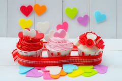Cupcake with heart decoration on a white wooden background. Love and Valentine`s day concept Royalty Free Stock Photography Cupcake with heart decoration on a white wooden background. Love and Valentine`s day concept Royalty Free Stock Photography