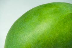 Delicious green mango fruit on a white background