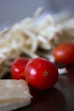 Uncooked ingredients of italian pasta with tomato and parmesan cheese royalty free stock image Uncooked ingredients of italian pasta with tomato and parmesan cheese royalty free stock image
