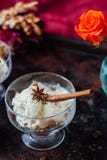 Delicious ice cream dessert in glass over black surface. Delicious ice cream dessert in glass over black surface Stock Photography Delicious ice cream dessert in glass over black surface. Delicious ice cream dessert in glass over black surface Stock Photography