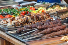Delicious kebab on a skewer on the counter Stock Photos Delicious kebab on a skewer on the counter Stock Photos