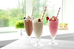 Delicious milkshakes on table stock photo Delicious milkshakes on table stock photo