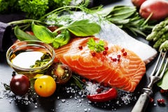 Delicious portion of fresh salmon fillet with aromatic herbs, royalty free stock photography Delicious portion of fresh salmon fillet with aromatic herbs, royalty free stock photography