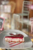 Raspberry cheesecake on white plate stock photography Raspberry cheesecake on white plate stock photography