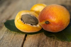 Delicious ripe apricots on rustic background. Healthy foods. Close up. royalty free stock photography Delicious ripe apricots on rustic background. Healthy foods. Close up. royalty free stock photography
