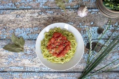 Delicious spinach fettuccine with passata sauce stock image Delicious spinach fettuccine with passata sauce stock image