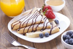 Delicious sweet French pancakes on a plate with fresh fruits stock photos Delicious sweet French pancakes on a plate with fresh fruits stock photos