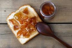 Delicious toasts with sweet jams and spoon on wooden background, top view, copy space royalty free stock image Delicious toasts with sweet jams and spoon on wooden background, top view, copy space royalty free stock image