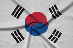 Den Sydkorea flaggan visas på ett sporttorkduketyg med många veck Baner för sportlag arkivfoto Den Sydkorea flaggan visas på ett sporttorkduketyg med många veck Baner för sportlag arkivfoto
