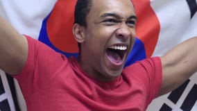 Den sydkoreanska fanen firar rymma flaggan av Sydkorea i ultrarapid royaltyfri fotografi Den sydkoreanska fanen firar rymma flaggan av Sydkorea i ultrarapid royaltyfri fotografi