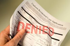 Denied loan application crumpled in hand Stock Image Denied loan application crumpled in hand Stock Image