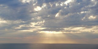 Sea sunset. Rays of the setting sun pierce the clouds. Seascape. Background royalty free stock photos Sea sunset. Rays of the setting sun pierce the clouds. Seascape. Background royalty free stock photos