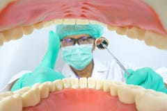 Dentist examine oral cavity with dental tool Royalty Free Stock Image Dentist examine oral cavity with dental tool Royalty Free Stock Image