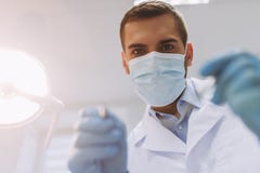 Dentist holding dental tools stock image Dentist holding dental tools stock image