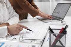 Businesswomen working together in office teamwork brainstorming accounting business concept stock photo Businesswomen working together in office teamwork brainstorming accounting business concept stock photo