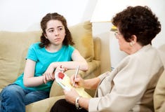 Depressed Teen In Therapy Stock Photos
